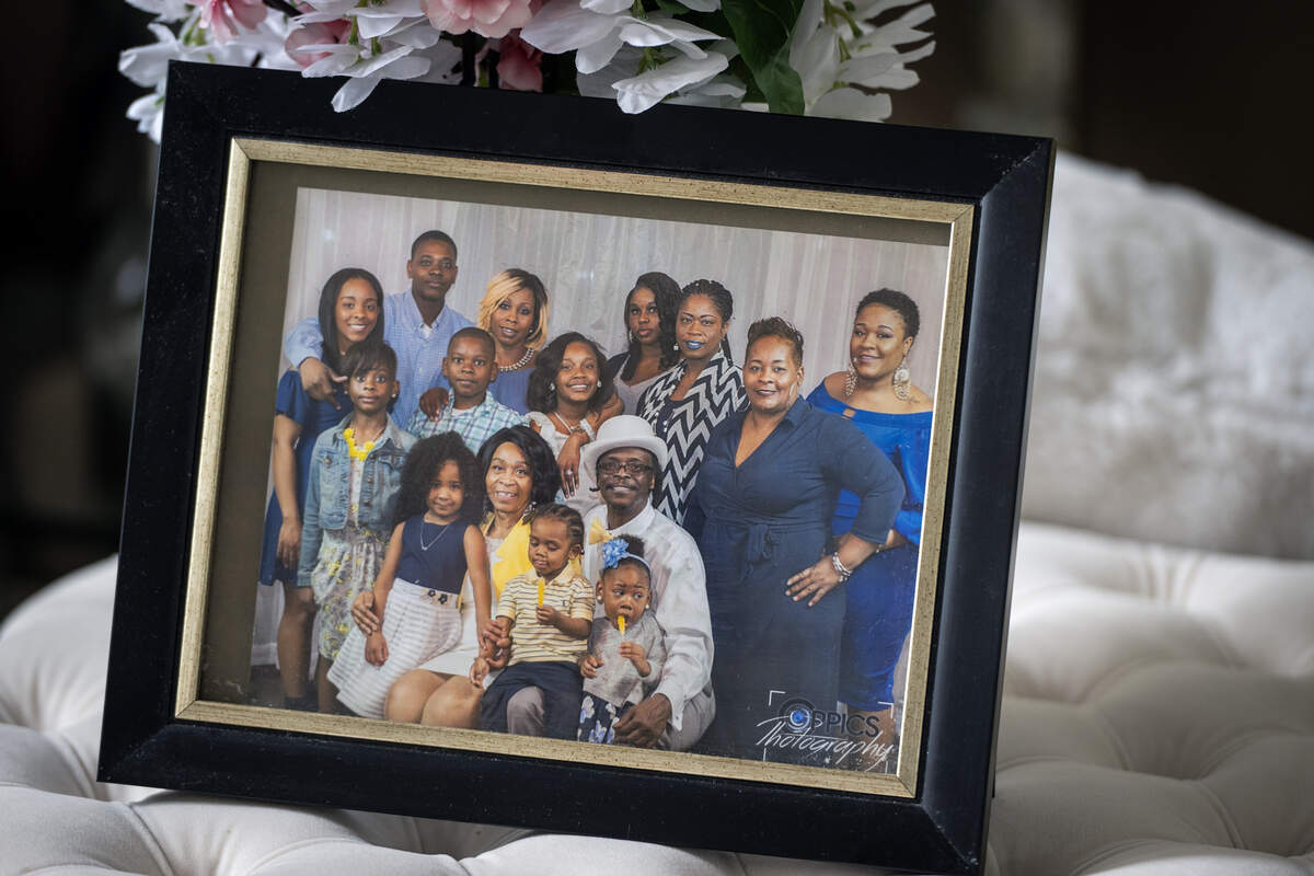 Diahna Carroll and her husband, Alphonso “Duke” Carroll, center, are seen in this family photo on display at their home on Thursday, Aug. 14, 2025, in Lee’s Summit.