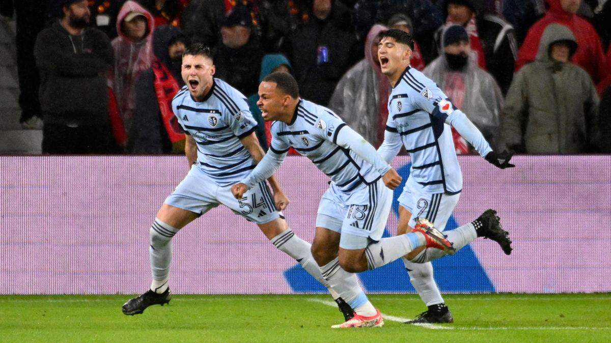 Sporting Kansas City players Remi Walter, Logan Ndenbe and Alan Pulido celebrate one of the club’s goals during Sunday night’s MLS Round One playoff match at CITY Park in St. Louis.