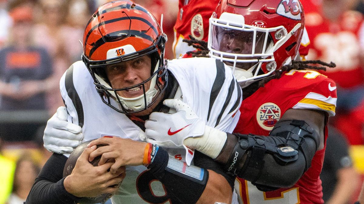 Cincinnati Bengals quarterback Joe Burrow (9) is sacked by Kansas City Chiefs linebacker Nick Bolton (32) in the third quarter during an NFL game on Sunday, Sept. 15, 2024 at GEHA Field at Arrowhead Stadium.