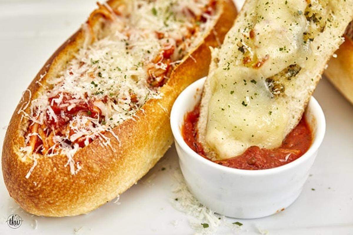 The Dugout Deli’s Spaghetti Motor Boat: House-made Italian bread “dugout” and then stuffed full of either its spaghetti and meatballs or spaghetti with meat sugo. The Boat and lid are topped with mozzarella and baked.