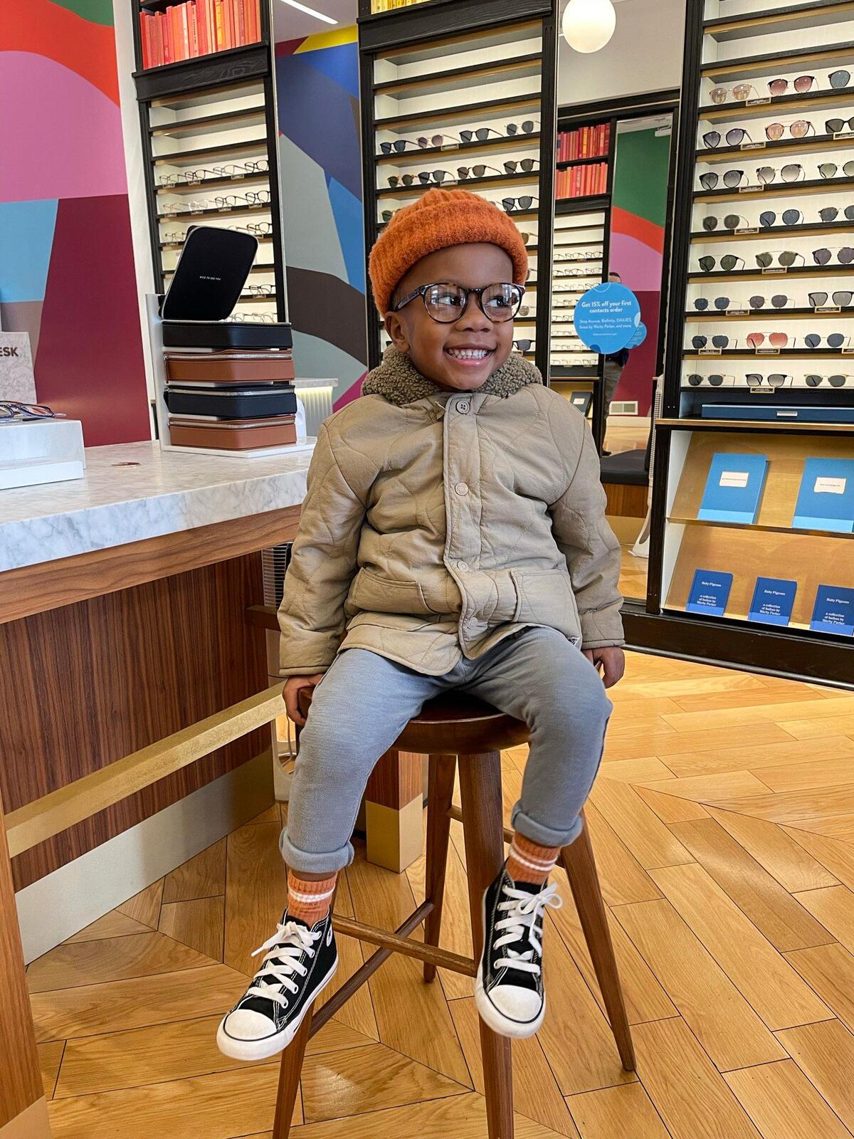 Tamra Gibson’s son Cohen trying on glasses at Warby Parker.