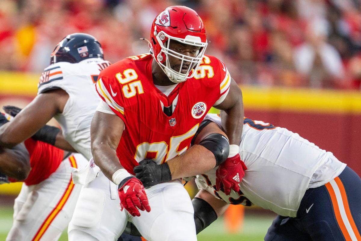 Kansas City Chiefs' Chris Jones (95) gets held during a pass rush in the first quarter of the Chiefs preseason game vs. the Chicago Bears at GEHA Field at Arrowhead Stadium on Friday, Aug. 22, 2025, in Kansas City.