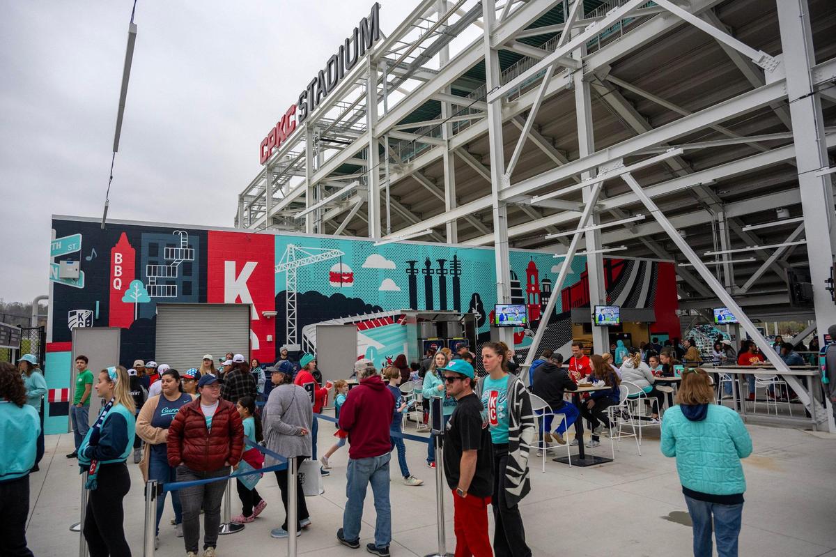 Fans line up at concession stands to grab food during halftime at a watch party at CPKC Stadium for the semifinal match against the Orlando Pride on Sunday, Nov. 17, 2024, in Kansas City.