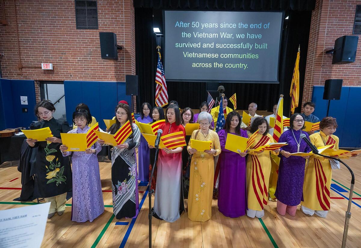 Members of the Vietnamese community sang “Viet Nam Viet Nam” during “Remembering Saigon,” a remembrance event marking of the 50th anniversary of the end of the Vietnam War.