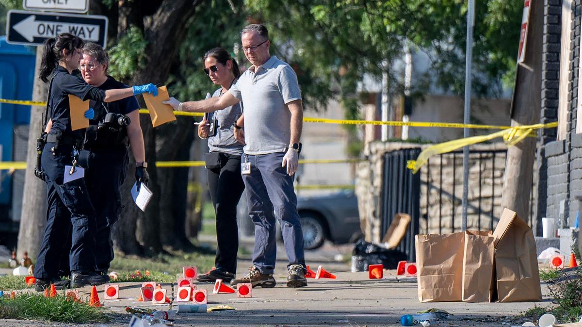 Cones mark evidence at a shooting scene where Kansas City police were investigating an early morning shooting Monday near East 70th Street and Prospect Avenue.