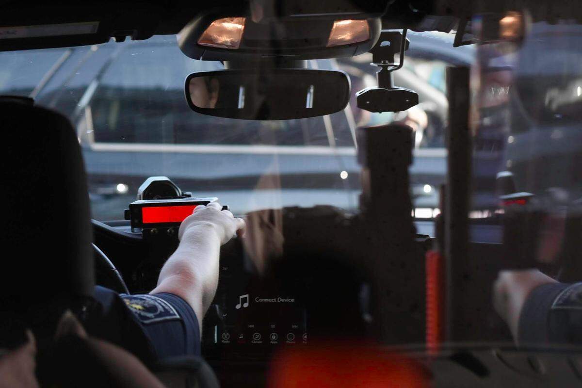 Merriam Police Department officers are seen in a police vehicle. The police department said it is monitoring for impaired drivers over Memorial Day weekend.