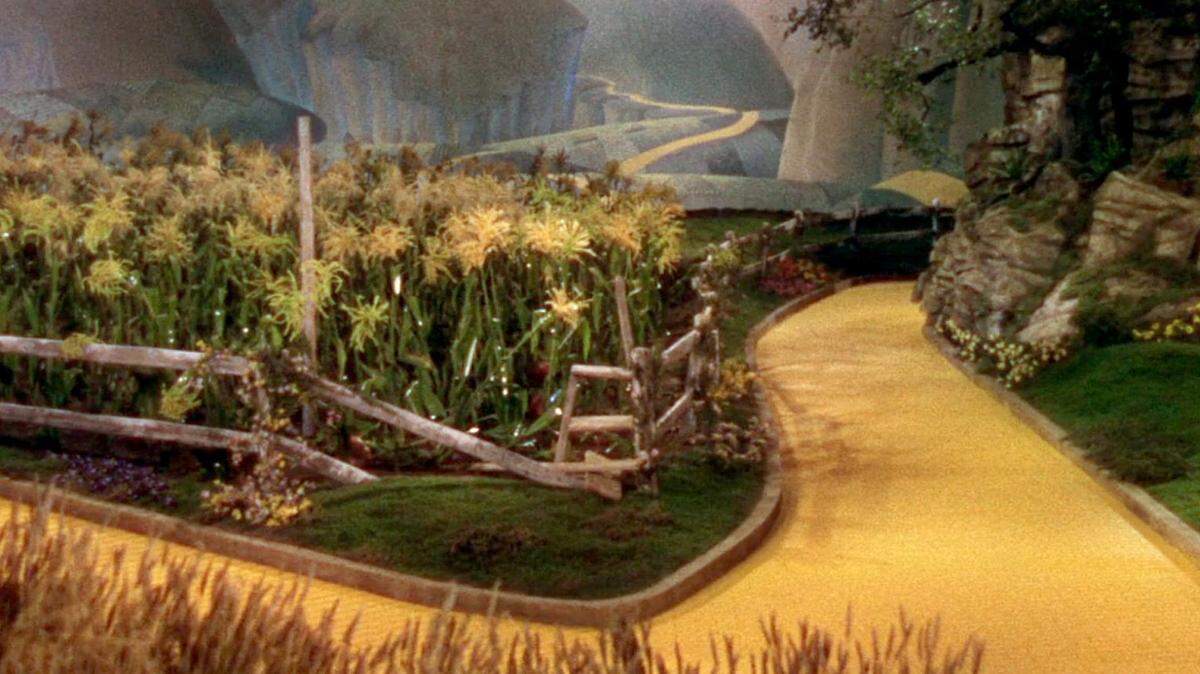 When Dorothy meets Scarecrow in "The Wizard of Oz" stage show, audiences will see this scene from the movie in the background.