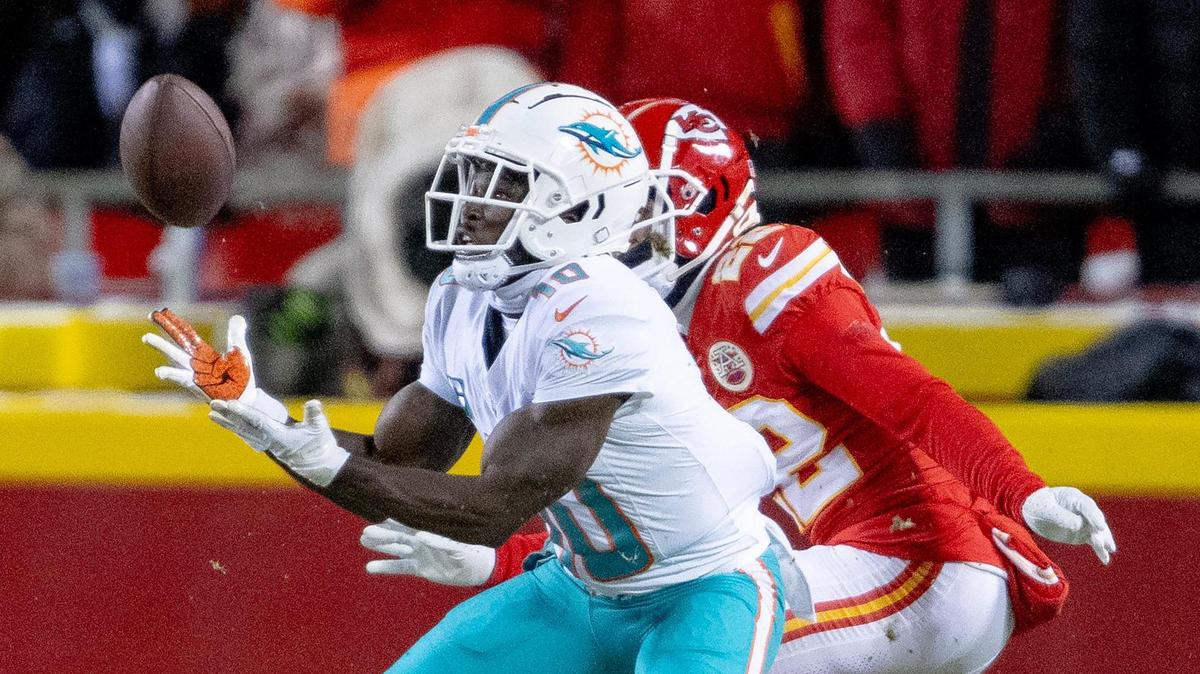 Miami Dolphins wide receiver Tyreek Hill (10) catches a touchdown pass as Kansas City Chiefs cornerback Trent McDuffie (22) commits pass interference during an AFC Wild Card game at GEHA Field at Arrowhead Stadium on Saturday, Jan. 13, 2024, in Kansas City.