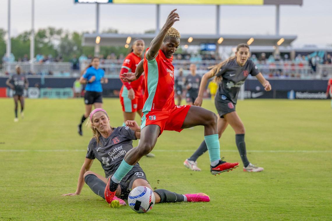 Kansas City Current forward Temwa Chawinga (6) jumps over Bay FC defender Kayla Sharples (27) in the first half during an NWSL game against Bay FC on Saturday, April 20, 2024, in Kansas City.