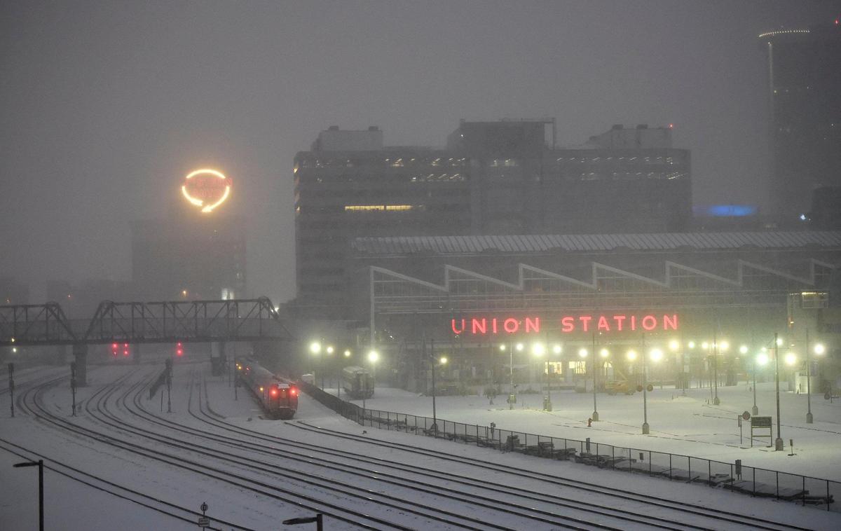 Snow continued to fall Wednesday morning over downtown Kansas City and the area as a major winter storm made its way across the plains states. Forecasters called for up to a foot of snow with heavier amounts south of the metro area. Temperatures will dip below zero on Thursday night.