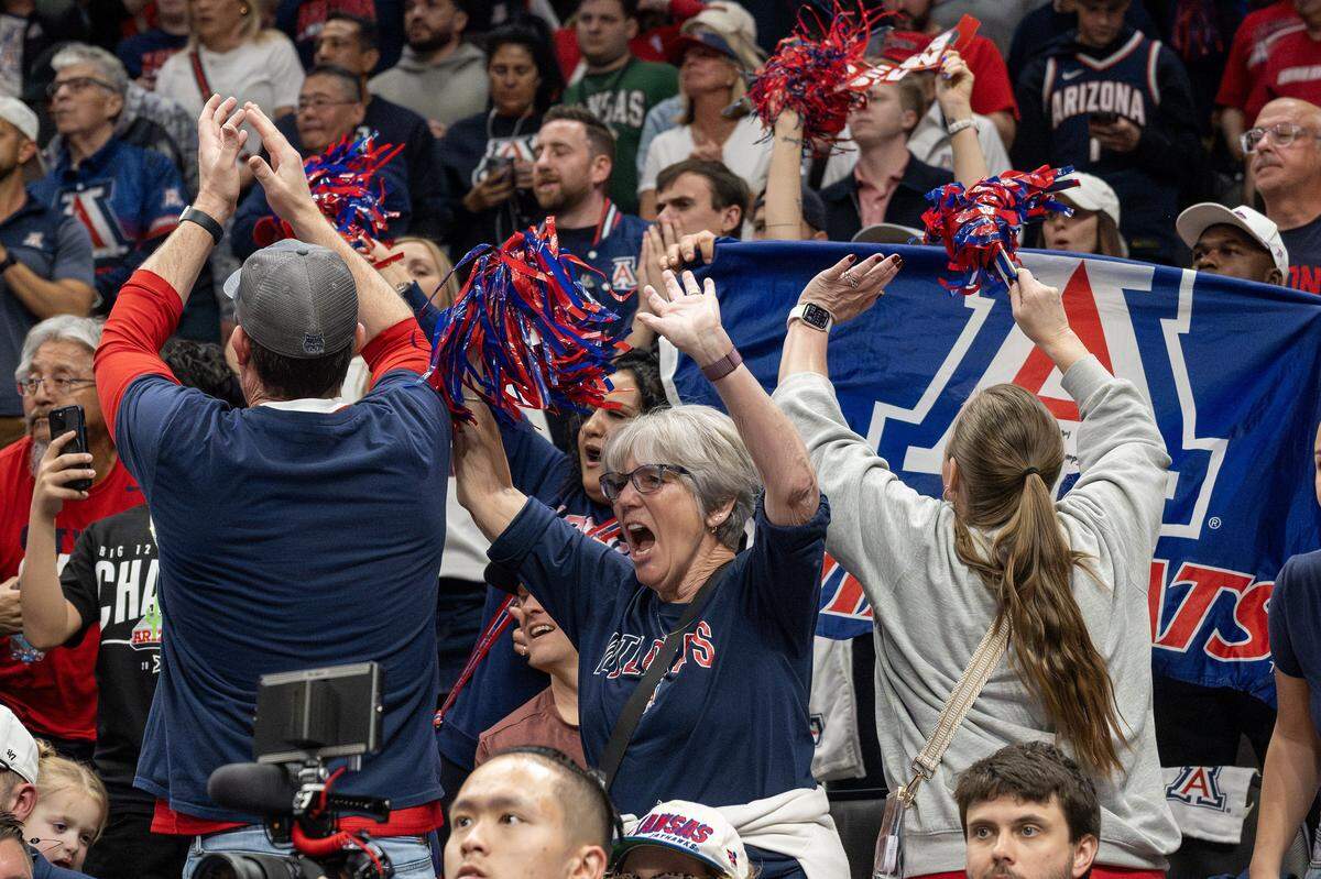 Arizona Wildcats fans celebrate during the second half of the Big 12 Men's Basketball Tournament Championship game against the Houston Cougars at T-Mobile Center on Saturday, March 14, 2026, in Kansas City.