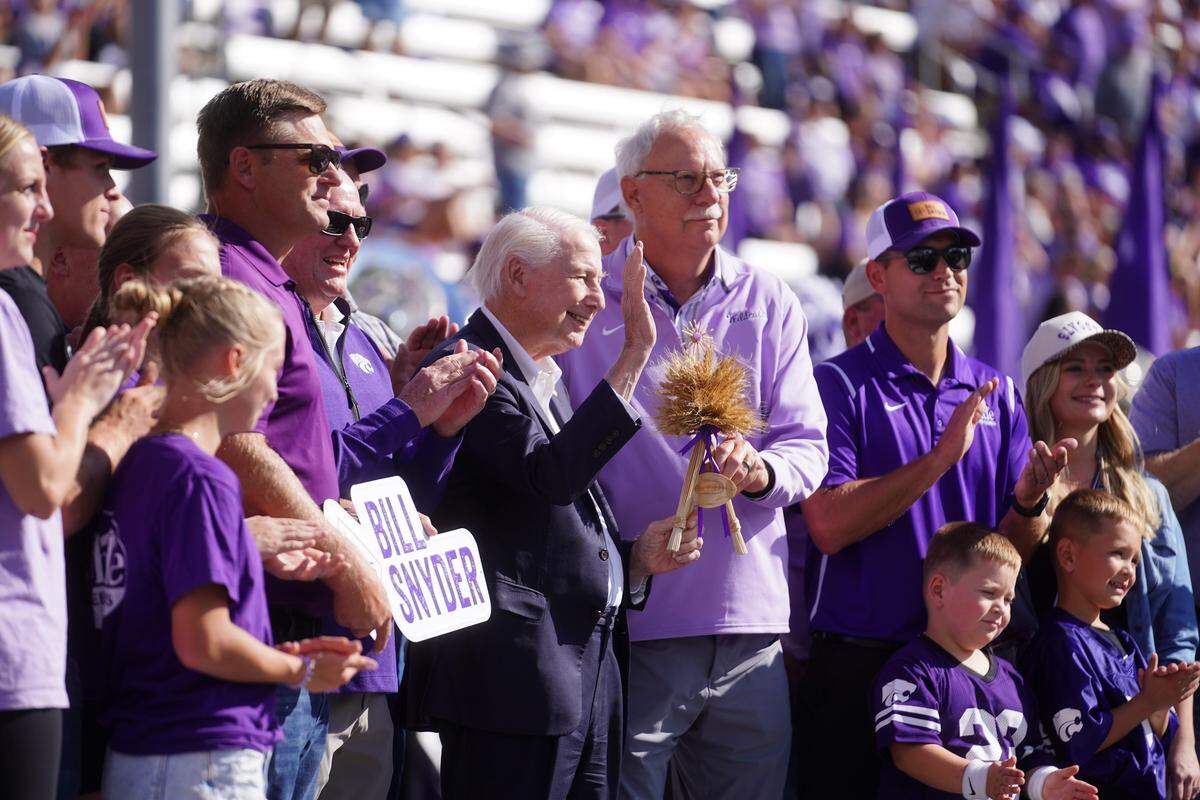 Former Kansas State Wildcats football coach Bill Snyder, waving in center of this photo, was honored before the game against the UCF Knights at Bill Snyder Family Stadium in Manhattan, Kansas on Saturday, Sept. 27, 2025.