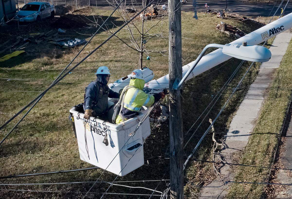 After storms Wednesday night left thousands in and around Kansas City without power, crews were busy Thursday morning making repairs. At 55th Street and Garfield Ave., power was being restored after a tree was blown down, taking the power lines with it.