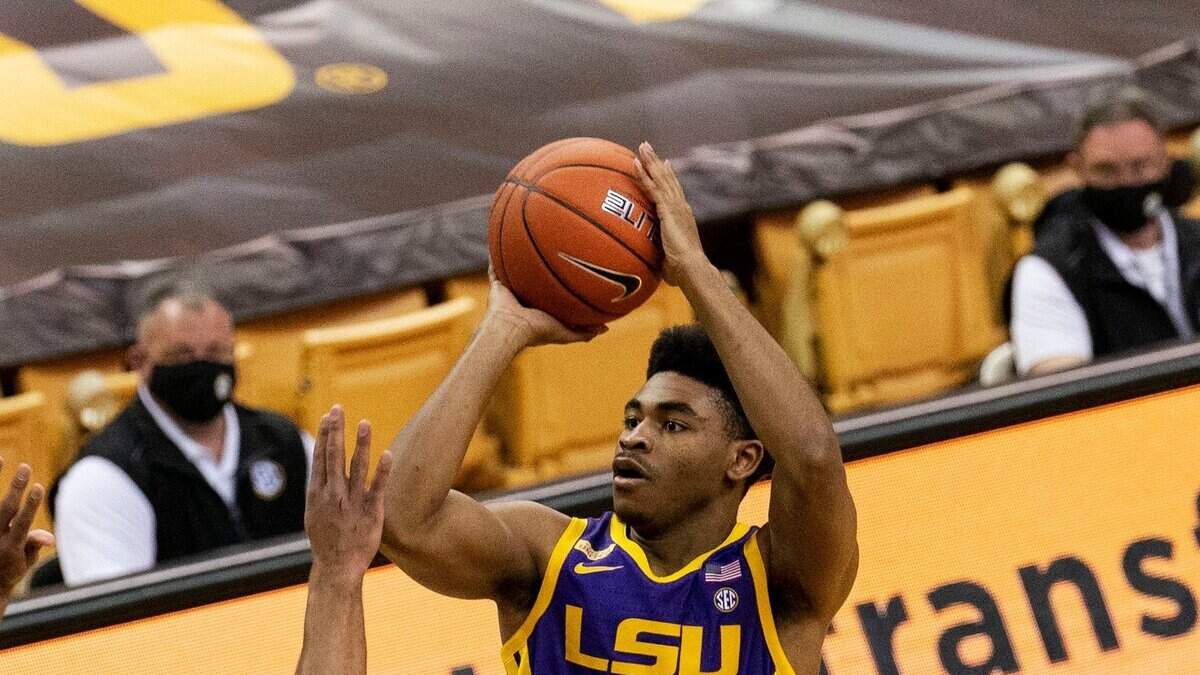 LSU’s Cameron Thomas (top) shoots over Missouri’s Mark Smith (left) and Jeremiah Tilmon (right) during the game Saturday, March 6, 2021, in Columbia, Mo.