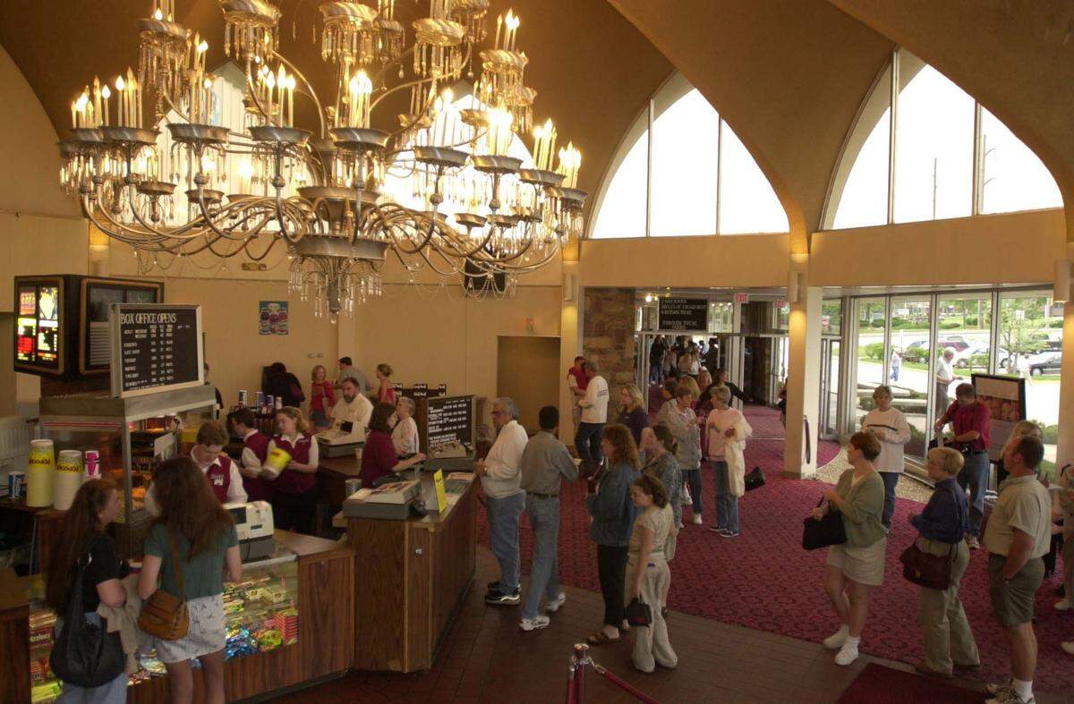 Under the lobby’s chandelier with more than 500 crystals and 200 lights, Glenwood Theatre patrons stood in line for tickets and concessions for the last time before the theater closed.