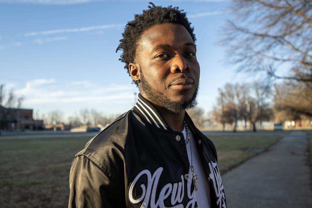 Mayson Victor, a young Haitian refugee, stands for a portrait near East High School on Tuesday, Dec. 16, 2025, in Kansas City.