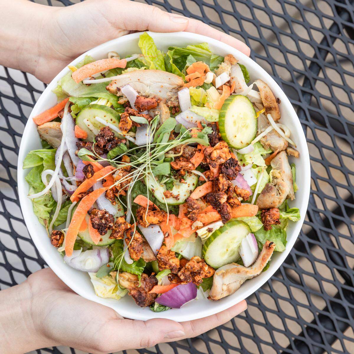 Cultivare’s Hanoi chicken salad with bean sprouts, cucumbers, carrots, red onion, mint, sambal candied peanuts and marinated chicken thigh.