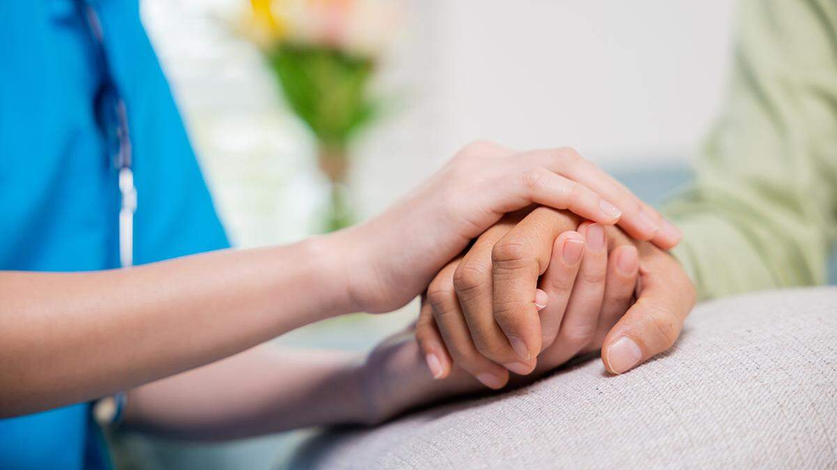 Closeup hand. Young woman helping hold hands offering her senior man, Caring nurse helping elderly old man care gets help from hospital, medical health care, International Day for the Elderly concept senior nursing medical medicine
