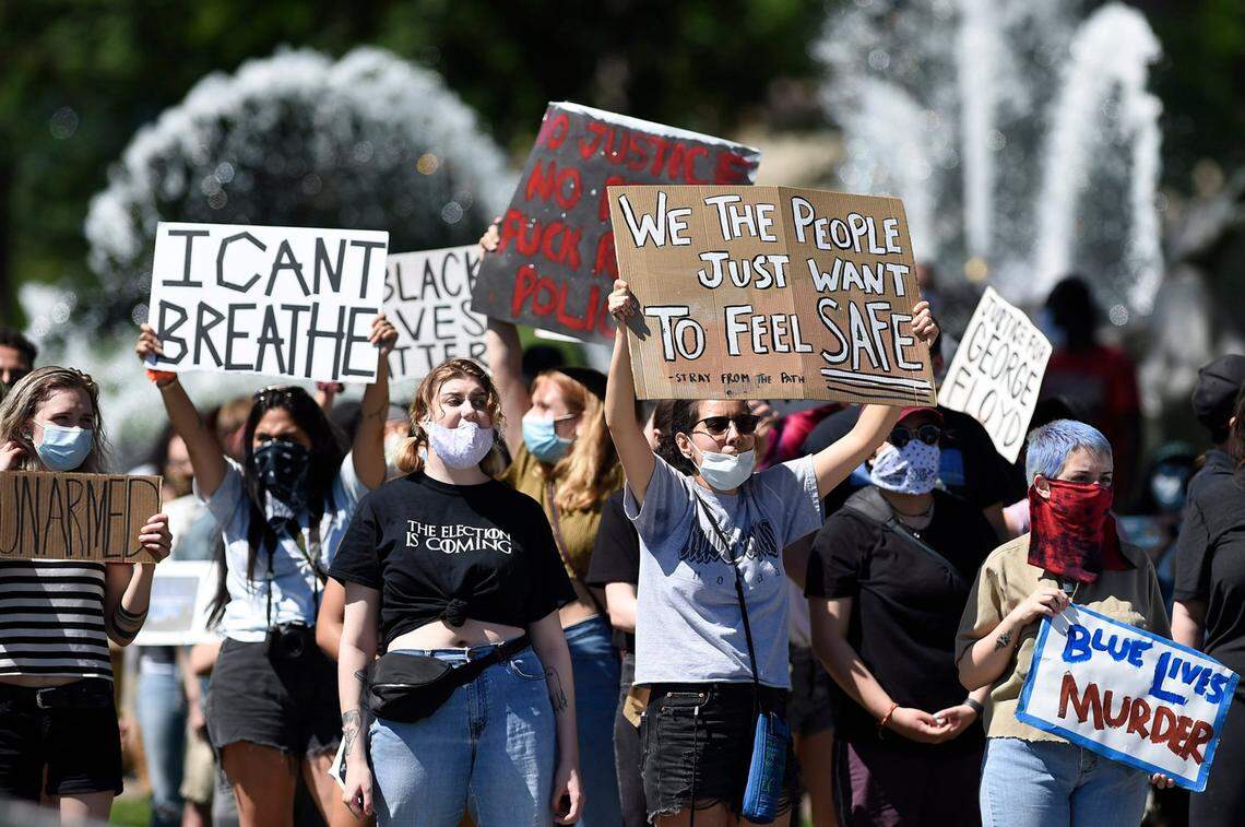 People protesting police brutality and the death of George Floyd gathered Friday, May 29, 2020, at the J.C. Nichols fountain on the Country Club Plaza in Kansas City. Protests have been erupting all over the country after George Floyd died earlier this week in police custody in Minneapolis.  