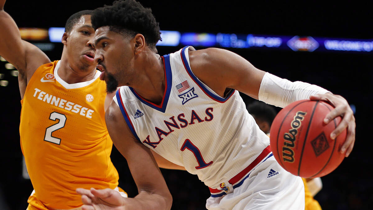 Kansas forward Dedric Lawson tried to work his way past Tennessee forward Grant Williams Friday night’s game against Tennessee in Brooklyn.
