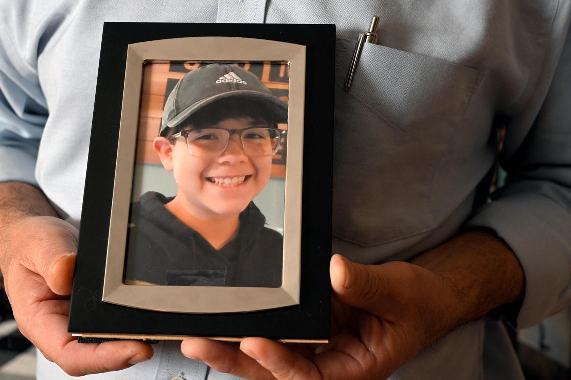 Andy Burris of Lansing, Kansas, holds a photo of his 15-year-old son Nicholas “Cruz” Burris. Cruz died of fentanyl poisoning at home on Jan. 18.