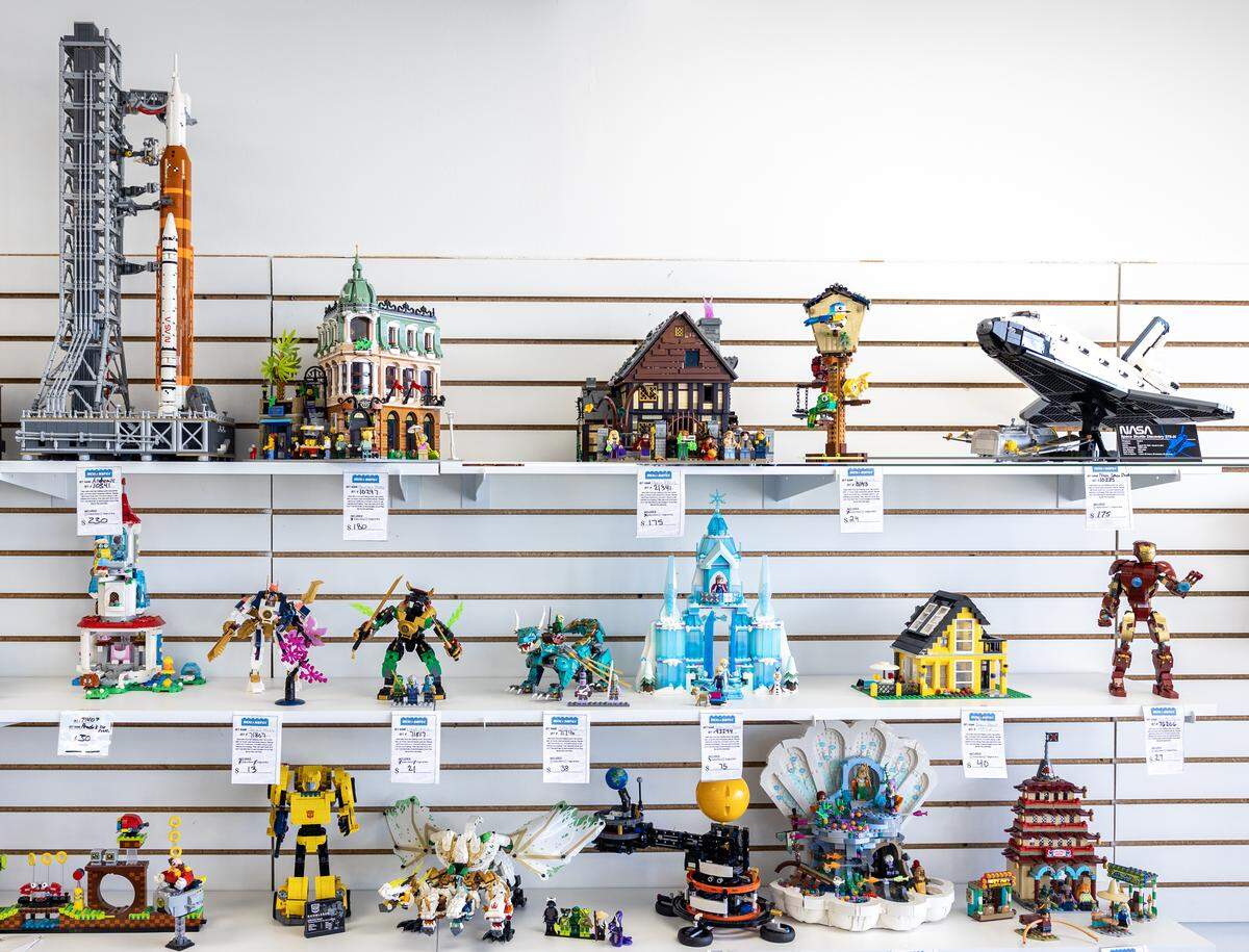 Used Lego sets sit on shelves at Bricks & Minifigs Lee’s Summit on Thursday, Feb. 5.