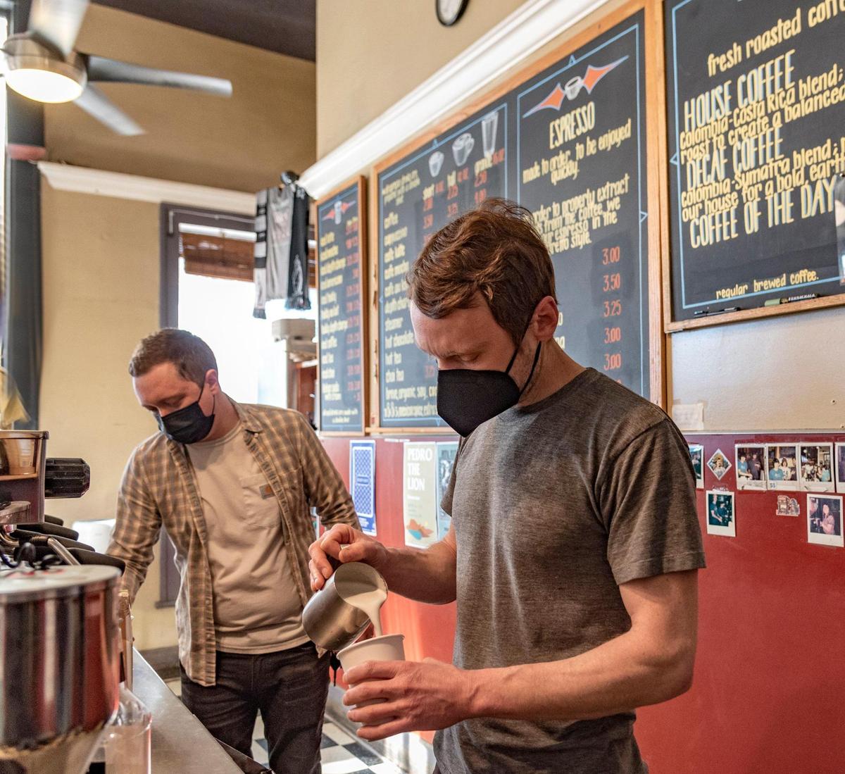 Jesse Trible, left, and Nathan Ferrugia prepared coffee delights on Wednesday for customers at the Broadway Cafe in Kansas City.