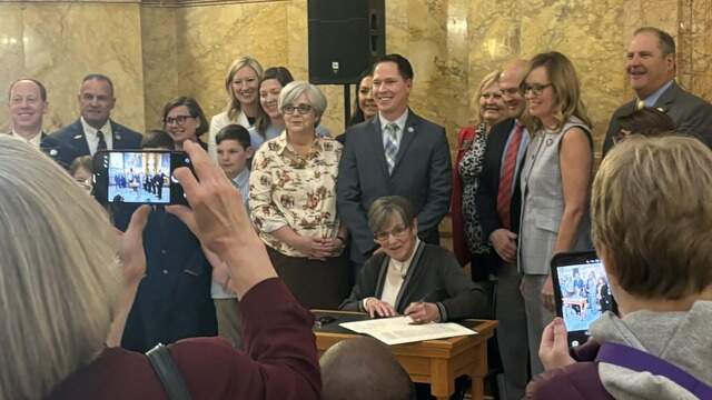 Kansas governor signs bell-to-bell school cellphone ban | Kansas City Star
