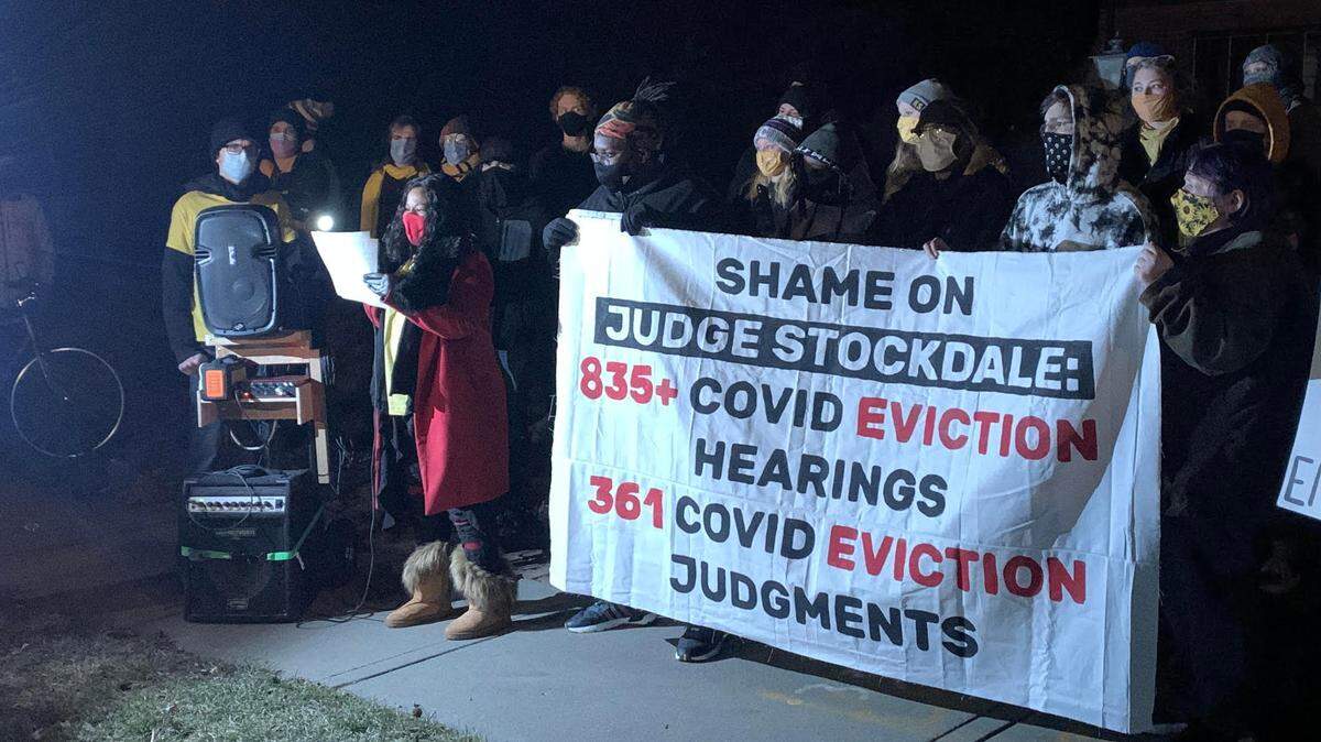 KC Tenants leader Tiana Caldwell, in front of a Jackson County judge’s house, demands accountability and calls for the eviction moratorium to be extended.