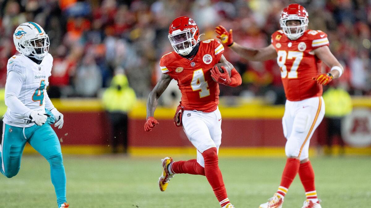 Kansas City Chiefs wide receiver Rashee Rice (4) outruns Miami Dolphins cornerback Kader Kohou (4) during an AFC Wild Card game at GEHA Field at Arrowhead Stadium on Saturday, Jan. 13, 2024, in Kansas City.
