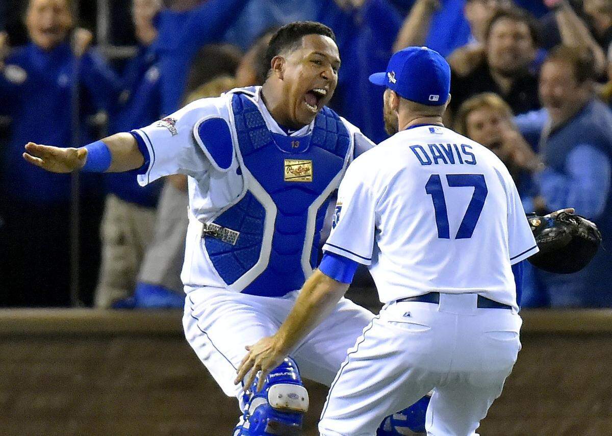Kansas City Royals catcher Salvador Perez ran to relief pitcher Wade Davis after the Royals defeated Toronto 4-3 to win the ALCS championship Friday, October 23, 2015 at Kauffman Stadium in Kansas City, Mo.