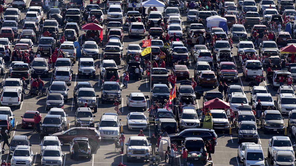 Fans tailgate in the parking lot outside Arrowhead Stadium before the game between the Kansas City Chiefs and the Las Vegas Raiders on Dec. 12, 2021.