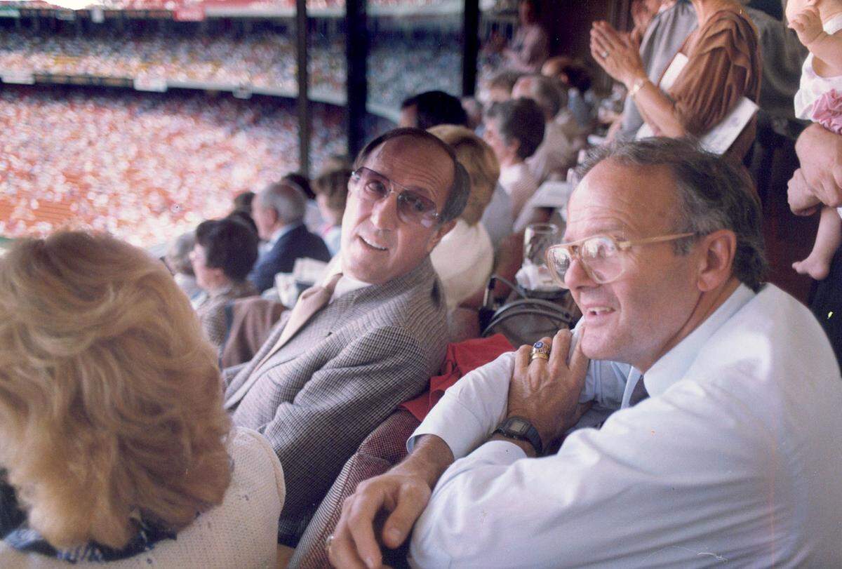 NFL Commissioner Pete Rozelle (left) chats with Kansas City Chiefs owner Lamar Hunt during a football game at Arrowhead Stadium in 1983.