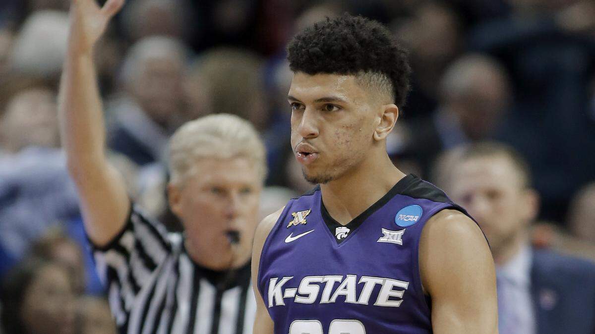 Kansas State's Mike McGuirl is only 6-2, but he had to play bigger against Kentucky on Thursday night.