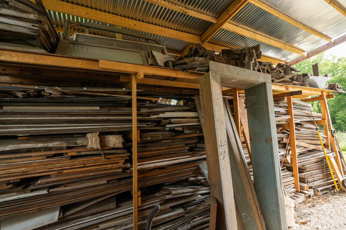 Wood that was removed and collected from Sauer Castle, a mansion built in the 1800s, on Friday, July 11, 2025 in Kansas City, Kansas. The house is being remodeled by Mike Heitmann, a local engineer and home enthusiast. Heitmann’s plans include using the recycled wood from the house as keepsakes for guests.