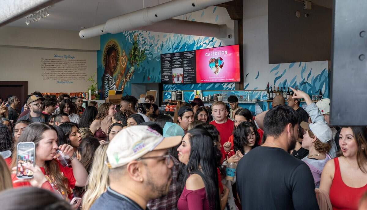 People pack inside Café Corazón as they dance during the Bad Bunny look-alike contest on Saturday, Feb. 14, 2026, in Kansas City.