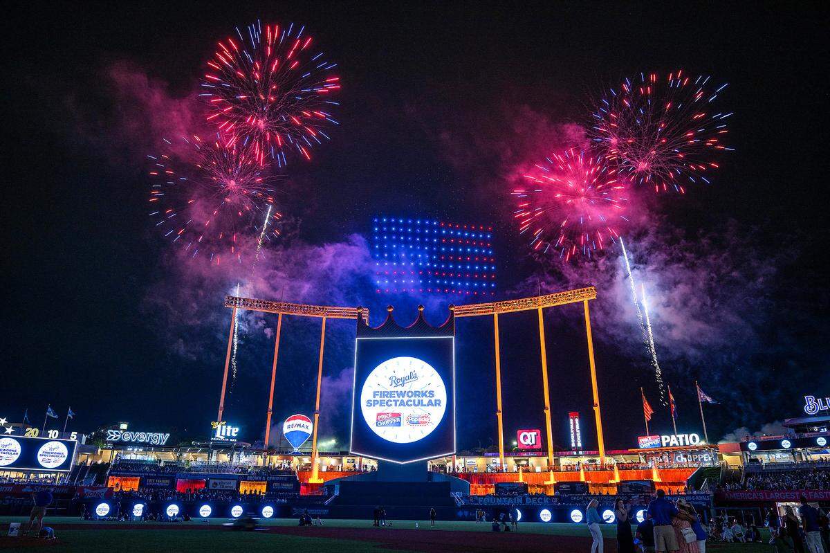 An American flag formed by lighted drones shines between the fireworks bursting over Kauffman Stadium Wednesday night after the Royals played the Tampa Bay Rays.