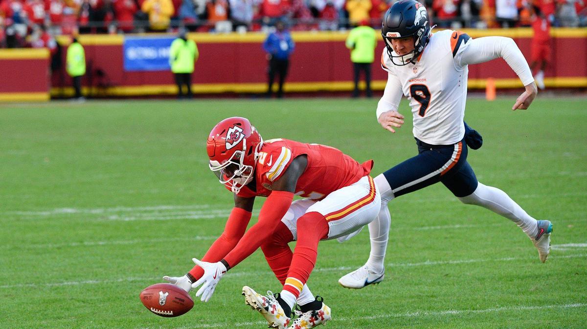 Kansas City Chiefs cornerback Joshua Williams (2) recovers the ball at the end of the game as Denver Broncos punter Riley Dixon (9) chases him down after the Chiefs blocked a field goal attempt on the final play of the game on Sunday, Nov. 10, 2024, at GEHA Field at Arrowhead Stadium.