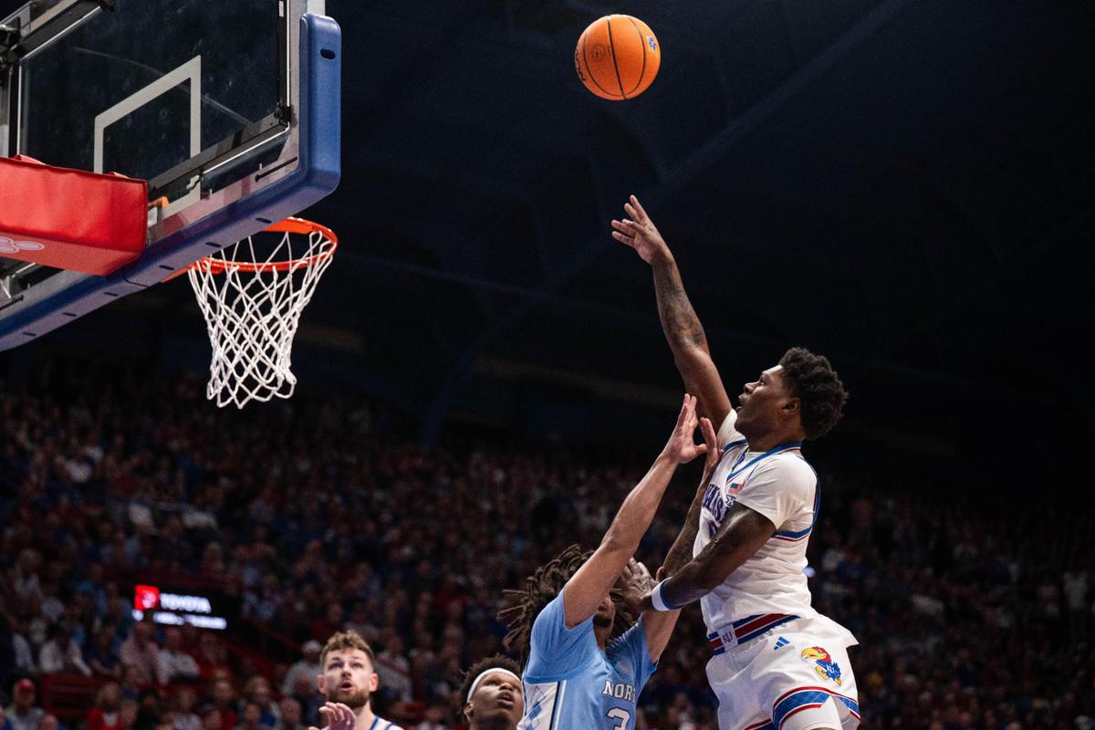 Kansas Jayhawks guard AJ Storr, right, shoots a floater over a North Carolina Tar Heels defender during the first half of a men’s basketball game at Allen Fieldhouse in Lawrence, Kan., on Friday, Nov. 8, 2024.