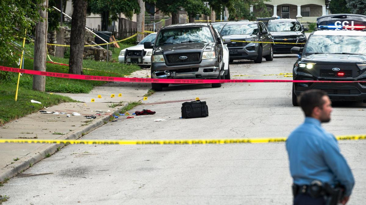 Police block off the scene of an officer involved shooting near the corner of Strong Avenue and South 37th St. on Tuesday, July 18, 2023, in Kansas City, Kan. According to a statement from the department, officers shot a person who was suspected of stabbing two people, one fatally.