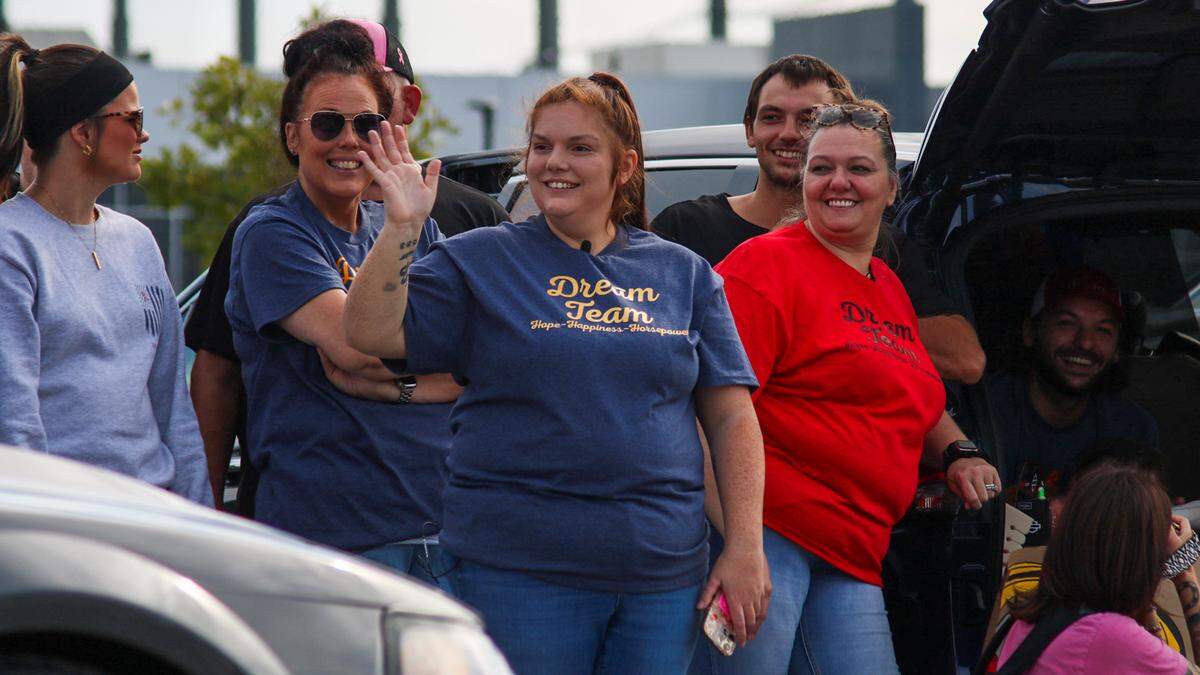 Chandler Langford and her family wave at participants of a parade on Oct. 11, 2025, that was organized to honor her 3-year-old son Tucker.