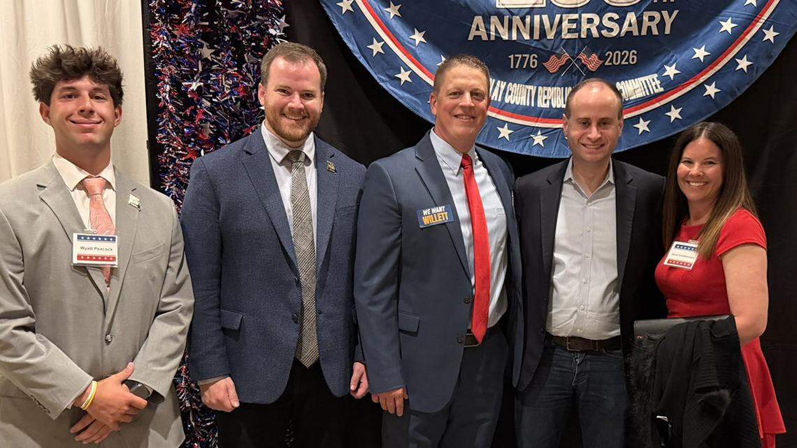 We should all “back the blue,” says Toriano Porter. That doesn’t mean Missouri congressional candidate Nathan Willett (second from left) should align himself with Eric DeValkenaere (center).