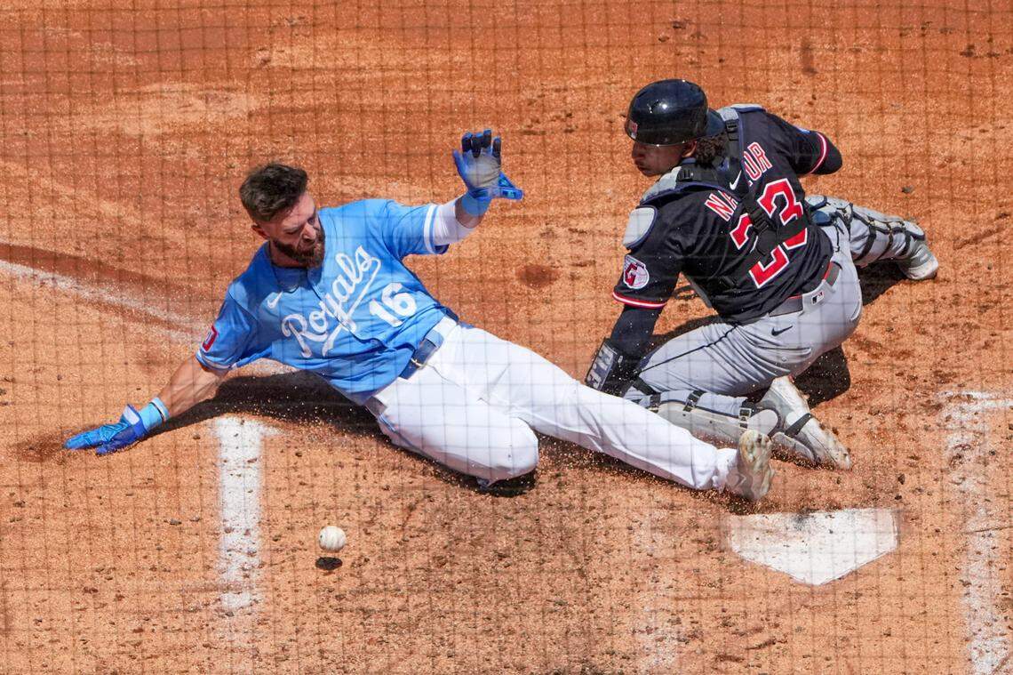Cleveland Guardians catcher Bo Naylor applies a tag, minus the ball, on Royals left fielder John Rave during a play at the plate at Kauffman Stadium in Kansas City on Sunday, July 27, 2025.