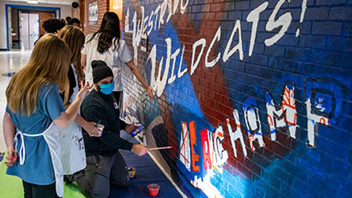 With advice from professionals affiliated with the InterUrban ArtHouse, young artists at Westridge Middle School recently painted a mural in the front hallway of their Overland Park building. One technique they learned was the “doodle-grid,” which maps out where various parts of the mural will go.