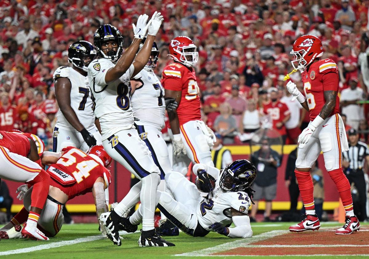 Baltimore Ravens quarterback Lamar Jackson signals touchdown as running back Derrick Henry scores against the Chiefs in the first quarter Thursday, Sept. 5, 2024, at GEHA Field at Arrowhead Stadium.