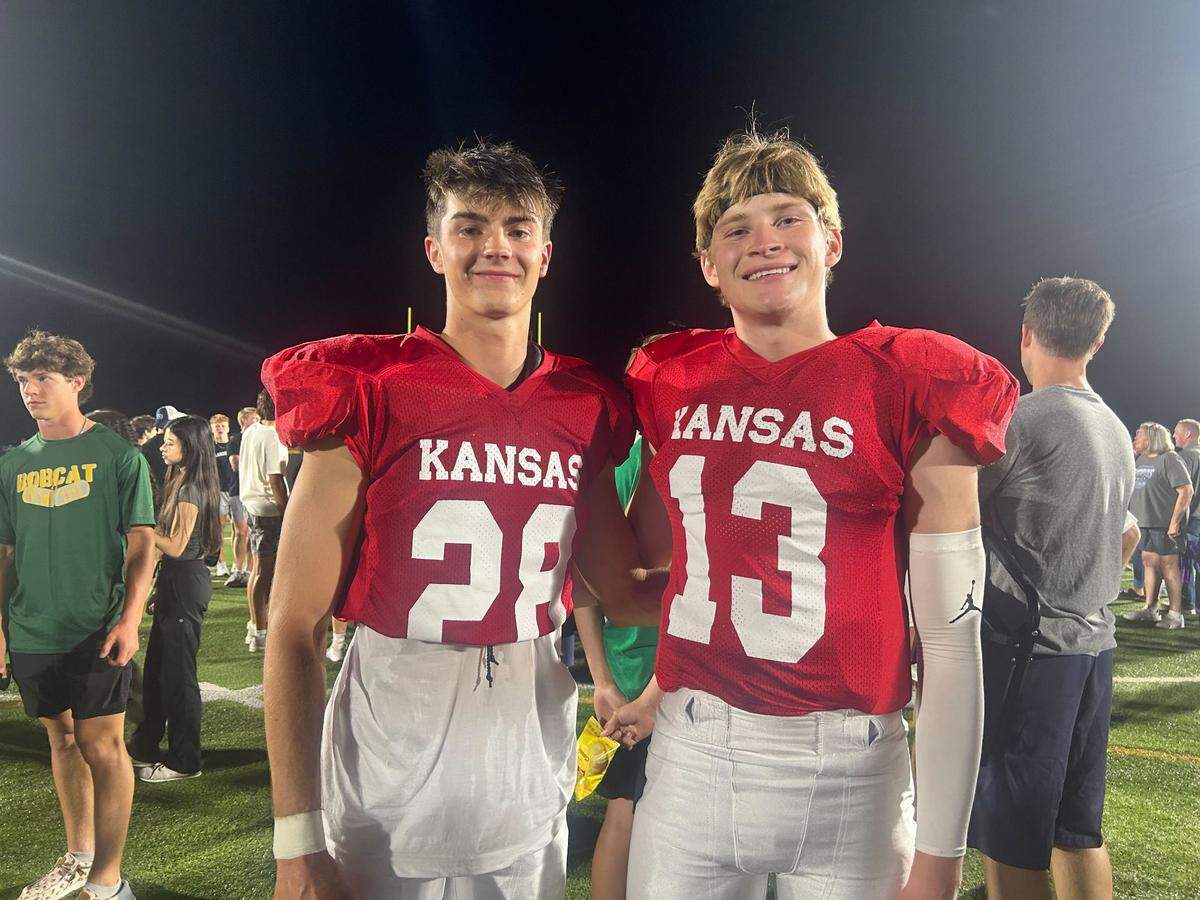 Quarterback Dylan Dunn (right) of Blue Valley Southwest poses on the field after his Kansas team defeated a Missouri squad on Friday, June 14, 2024. Dunn was named the game’s MVP.