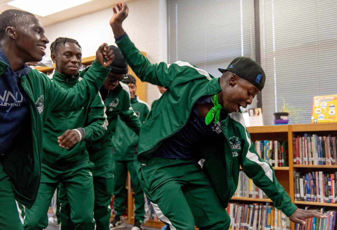 East High School forward Mayson Victor dances as his teammates cheer during a pep rally on Thursday, Nov. 17, 2022 in Kansas City.