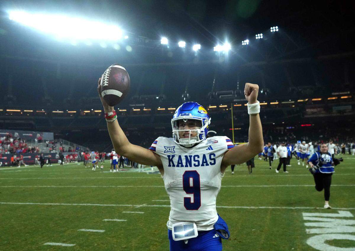 Kansas Jayhawks quarterback Jason Bean (9) celebrates after defeating the UNLV Rebels at Chase Field in Phoenix on Dec. 26, 2023.