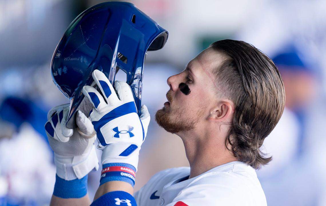 Kansas City Royals shortstop Bobby Witt Jr. dons his batting helmet in the dugout for a first-inning at-bat during the Royals’ home opener Thursday with the Minnesota Twins.