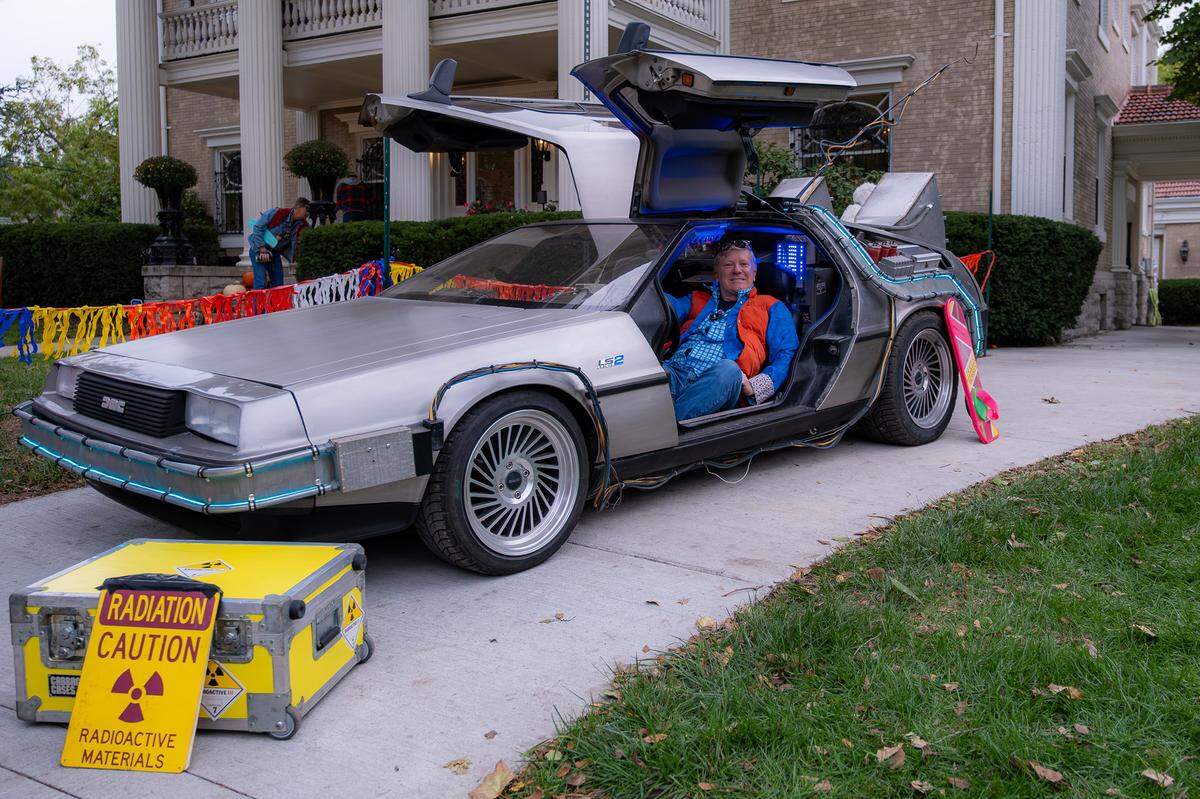 Jeffrey Linville, dressed as Marty McFly from the movie Back to the Future, borrowed a DeLorean from Hubbard’s Movie Cars to recreate the final scene of the original film in their front yard house for the annual Scare-It Halloween hosted by the Scarritt Renaissance Neighborhood Association. This Halloween was the last year for the event, which attracts thousands.